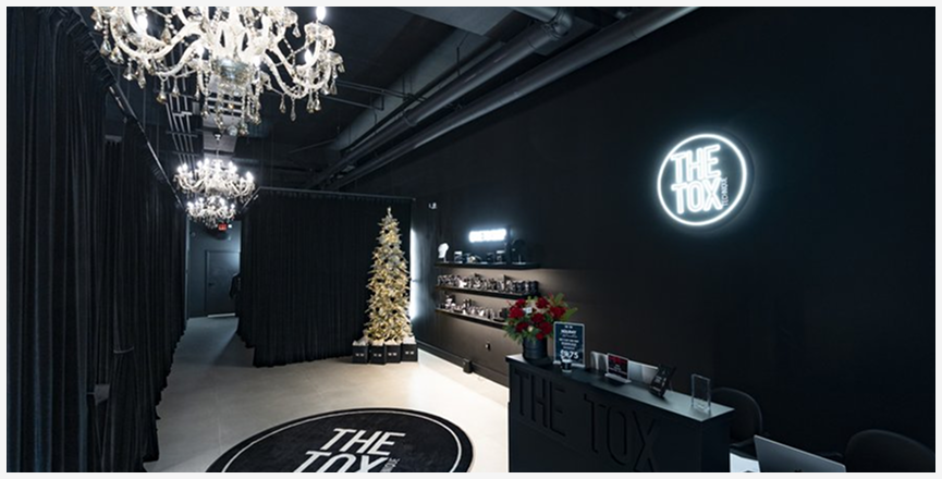 The Tox studio interior with neon signage